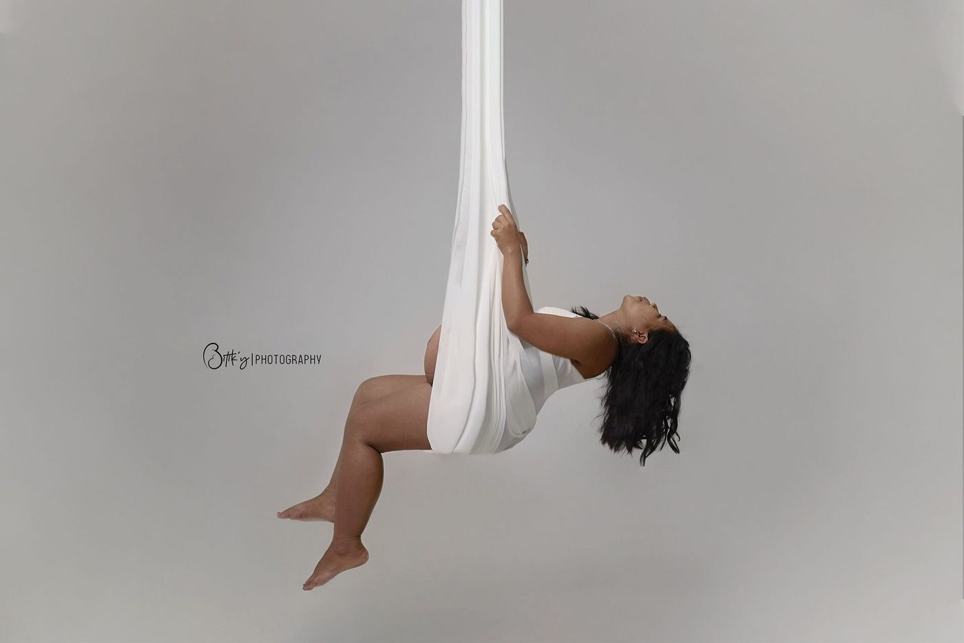 Artistic pregnancy session in the studio